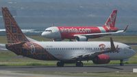 Pemerintah Malaysia Jajaki Pengalihan Pangsa Pasar Domestik AirAsia: Analisis Kritis